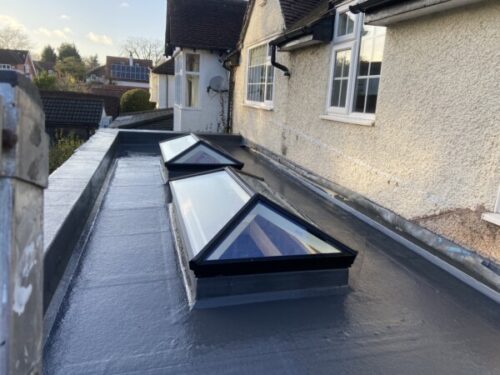 Rear flat roofed extension with lanterns in Bramhall