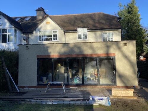 Rear flat roofed extension with lanterns in Bramhall