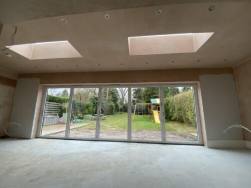 Rear flat roofed extension with lanterns in Bramhall