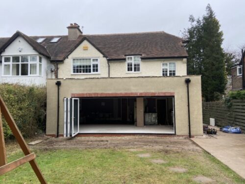 Rear flat roofed extension with lanterns in Bramhall